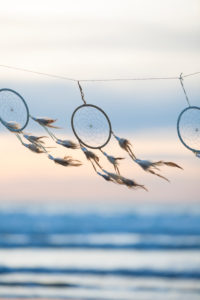 spanned dream catcher on the beach spanned dream catcher on the beach